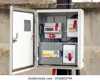 Introductory Machine And Electric Energy Meter In A Dashboard On A Pole On A Land Plot