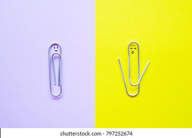 Introvert and Extrovert concept. Quiet character on purple and talkative character paper clips on yellow background