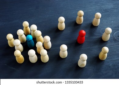 Introvert And Extrovert Concept. Wooden Figurines On A Desk.