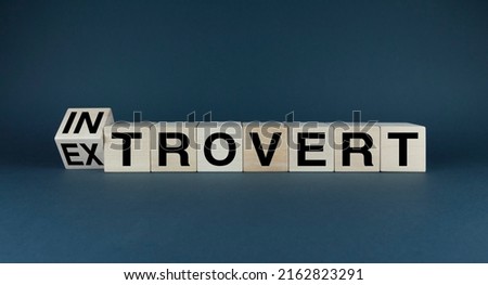 Introvert or Extrovert. Cubes form the choice words Introvert or Extrovert. Concept of personality types
