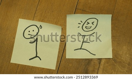 Introvert or Extrovert: two pieces of adhesive notes with a timid introverted stick man drawing and an outgoing extroverted stick figure, in a wooden background