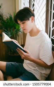 An Introvert Guy Prefer Reading The Book At His Home. He Happy To Stay With His Beloved Activity.