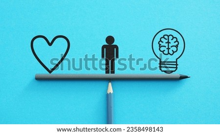Intuition versus Logic or the common sense are shown using a pictures of the heart and the lamp with brain. Emotion or logic