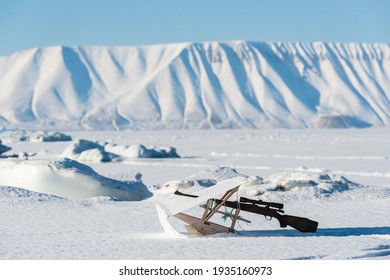 Inuit Hunting Rifle Lying In Snow