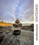 Inukshuk Beach Pastel Sunset | Inuksuk Against A Pastel Purple Ocean Sunset 