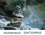 Inukshuk rock pile cairn trail marker pile in Mount Aspiring National Park, New Zealand. 