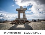 Inukshuk rock statue on top of Whistler mountain, Canada