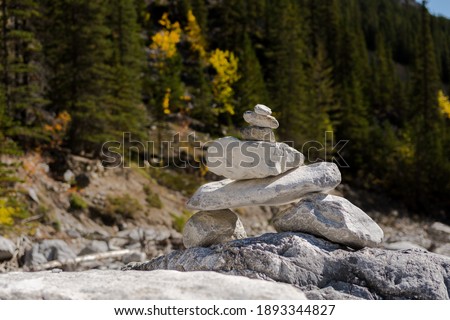 Inukshuk stacked stones Native American landmark at the Grotto Canyon Trail hike. Rock traditional pyramid direction marker used by Indigenous people