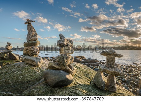 Inukshuk Stone Sculpture in the sunset on beach