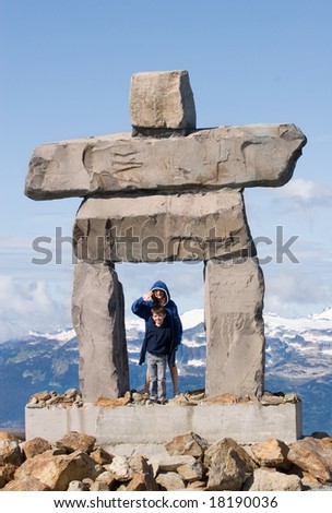 inukshuk with two children - traditional inuit symbol for 'the way'