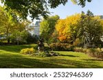 The Inuksuk monument on the National Assembly Square seen during a colourful sunny fall day, with the parliament in the background, Quebec City, Quebec, Canada