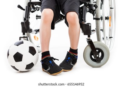 Invalid Or Disabled Child Boy Sitting On Wheelchair Hand Holding Soccer Sport Ball White Isolated