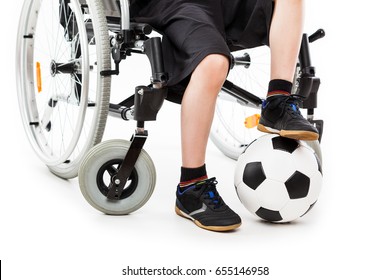 Invalid Or Disabled Child Boy Sitting On Wheelchair Hand Holding Soccer Sport Ball White Isolated