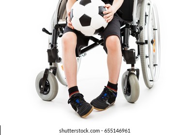 Invalid Or Disabled Child Boy Sitting On Wheelchair Hand Holding Soccer Sport Ball White Isolated