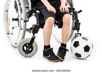 Invalid Or Disabled Child Boy Sitting On Wheelchair Hand Holding Soccer Sport Ball White Isolated