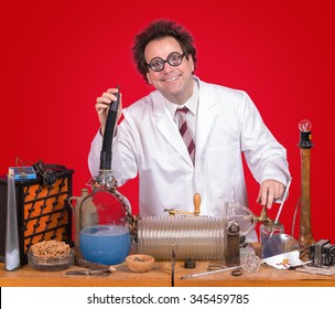  Inventor At His Desk With Equipment On Red Background