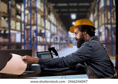 Inventory engineer uses barcode reader to verify products and orders, working on distribution and shipment. Customs compliance employee scanning merchandise tags and labels at warehouse.