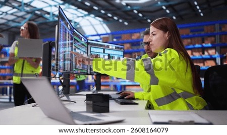 Inventory Manager Inputs Data On Computer Screen In Warehouse Office. Warehouse Staff Use Spreadsheets