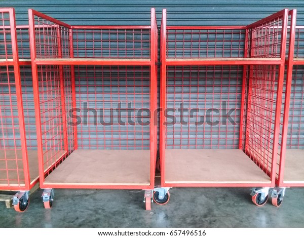 Inventory trolley\
red steel for sort in\
warehouse