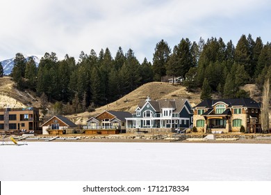 INVERMERE, CANADA - MARCH 17, 2020: frozen Windermere lake and rocky mountains in british columbia canada.