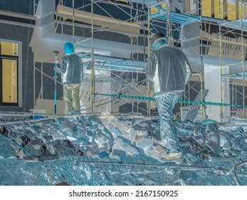 inversion of colors in the photograph of the construction site, the negative of the color photograph of the facade work and the control measurements of the volume of the stone, selective focus