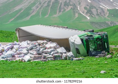 Inverted Big Truck On A Mountain Road