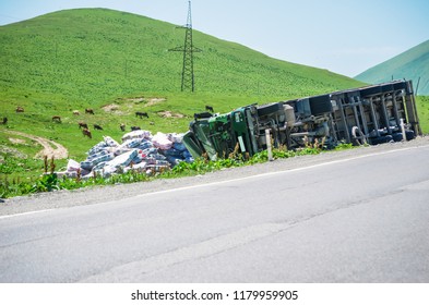 Inverted Big Truck On A Mountain Road