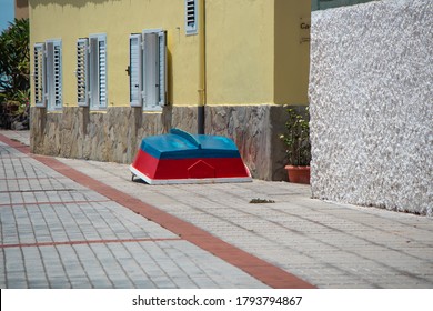 An inverted boat on the street near a house in a small village, Valle gran rey, La Gomera, Spain - Powered by Shutterstock