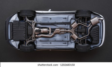 inverted car on a black background. bottom view of car - Shutterstock ID 1202683150