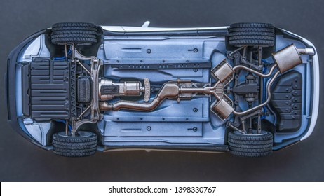 inverted car on a black background. bottom view of car