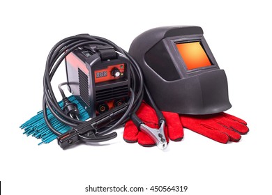 Inverter welding machine, welding equipment, isolated on a white background, welding mask, leather gloves, welding electrodes, high-voltage wires with clips, set of accessories for arc welding. - Shutterstock ID 450564319