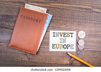 Invest In Europe Concept. Euro Money And British Coins With Passport