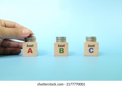 Investing Asset Allocation And Diversification Concept. Human Hand Stacking Coins On Multiple Blocks.