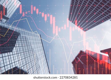 Investing, trading and real estate market crisis concept with digital red financial chart candlestick and graphs on modern skyscraper tops bottom view background, double exposure - Shutterstock ID 2270834281