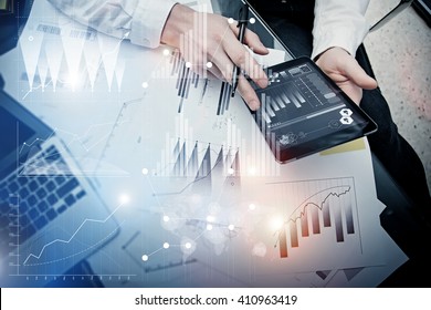 Investment banker working process.Picture trader work market report modern tablet.Use electronic device.Graphic icons,stock exchange reports interfaces.Business project startup.Horizontal,film effect