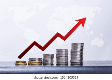 Investment Concept, Coins Graph Stock Market - Stacks Of Coins In A Inflation Chart And Red Arrow