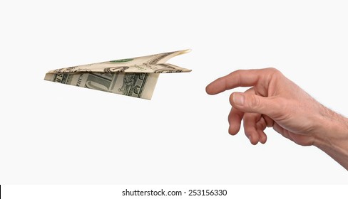 Investment concept.Hand throwing a dollar paper plane isolated on white background.