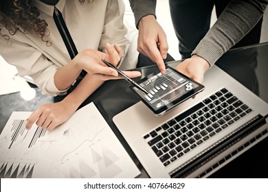 Investment Department Working Process.Photo Man Showing Reports Modern Tablet Screen.Statistics Graphics Screen.Private Banker Manager Holding Pen For Signs Documents. New Business Project Startup.