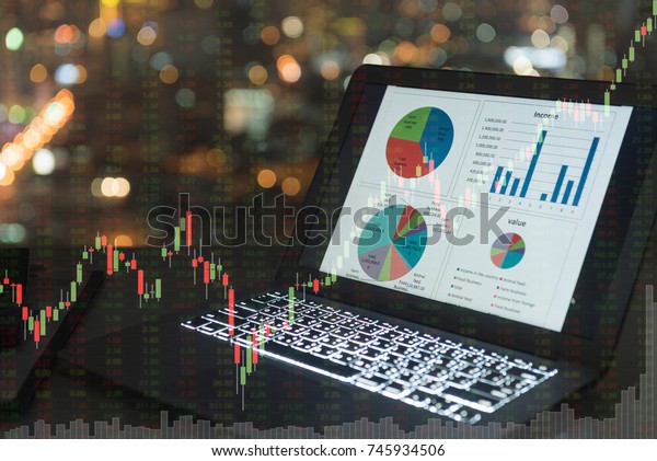 investment\
portfolio on screen laptop computer with index stock market and\
chart with uptrend stock market\
graph.