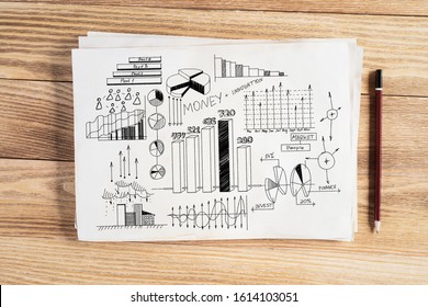 Investment statistics and analytics pencil hand drawn with group of business doodles. Financial charts and graphs. Strategy planning and analysis. Workplace with paper and pencil lying on wooden desk.