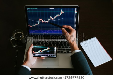 investment stockbroker profit analysis. Stock trading graph price prediction and profit gain. Trade graph chart. Financial manager workplace desk
