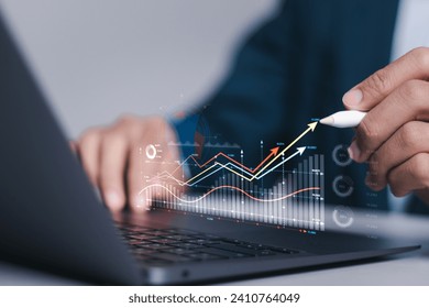 Investment strategy planning. Businessman use computer laptop with analyzes financial growth graph for long-term investment, Financial goals and global economic business planning.