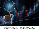 Investor analyzing chart of stock market price movements. Stock investment strategy for buying and selling opportunities. Man holding a magnifying glass and analyzing.