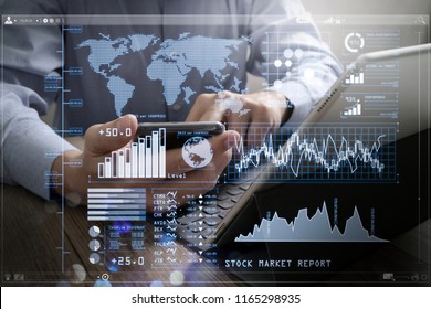 Investor analyzing stock market report and financial dashboard with business intelligence (BI), with key performance indicators (KPI).success businessman using smart phone and laptop computer. - Shutterstock ID 1165298935