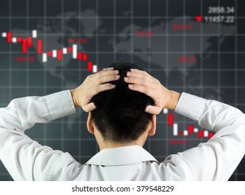 An Investor Is Looking At Screen Showing Stock Market Crash