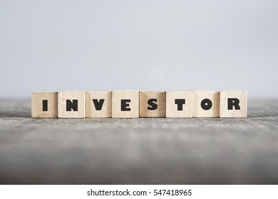 INVESTOR word made with building blocks - Shutterstock ID 547418965
