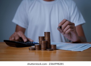  investors man are placing coins in a growing position with savings finance money concept,Save money for future and Retirement. - Shutterstock ID 2366998281