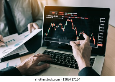 Investors are pointing to laptops that have investment information stock markets and partners taking notes and analyzing performance data.