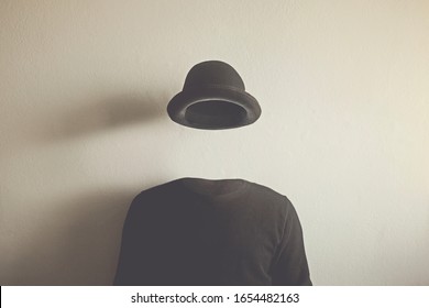 invisible man wearing black bowler, surreal concept of absence of identity - Shutterstock ID 1654482163