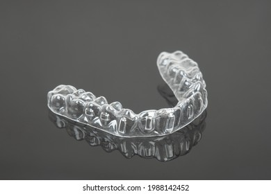 Invisible Orthodontics Cosmetic Brackets On Black Background. Tooth Aligners, For Beautiful Smile.